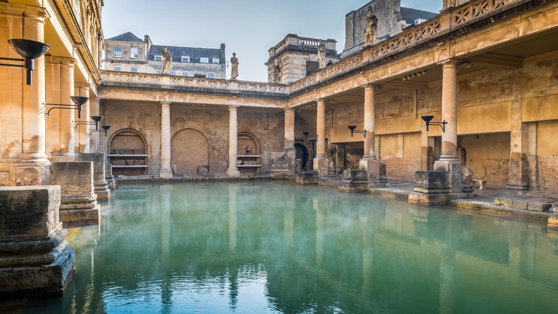 The Great Bath at the Roman Baths, steam rising off the water