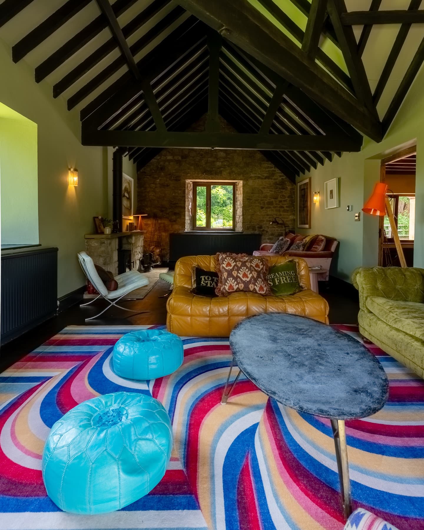 Blackened roof trusses above the sitting room at The Old Stables